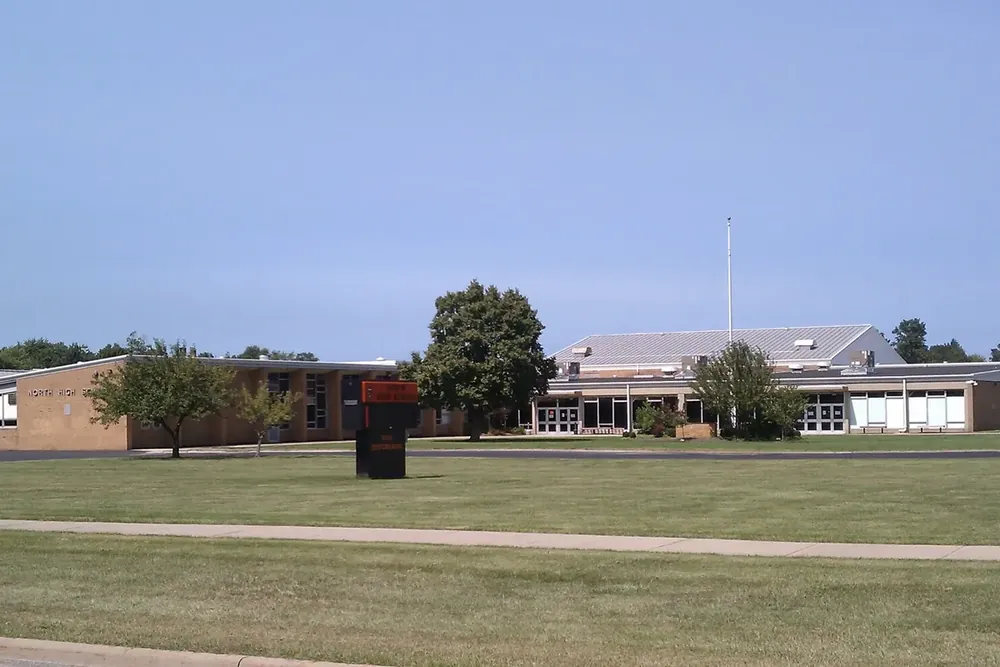 The low brick buildings of North High School behind a wide lawn in Eastlake, Ohio