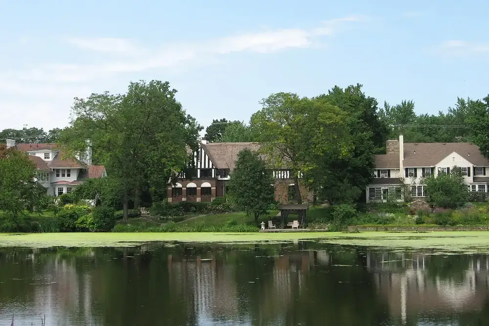 Large brick and Tudor-style houses across the water of Green Lake in Shaker Heights, Ohio