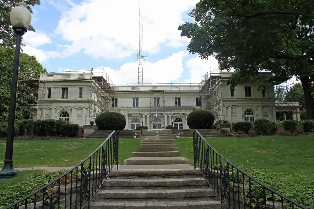 Stone steps rising to the white Harry Coulby Mansion in Wickliffe, Ohio