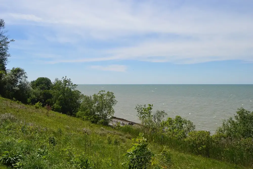 Lake Erie shoreline seen west from a grassy bluff at Lakefront Lodge in Willowick, Ohio